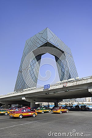 CCTV headquarters with taxis, Beijing, China Editorial Stock Photo